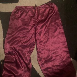 It’s a silk maroon ish color not very stretchy